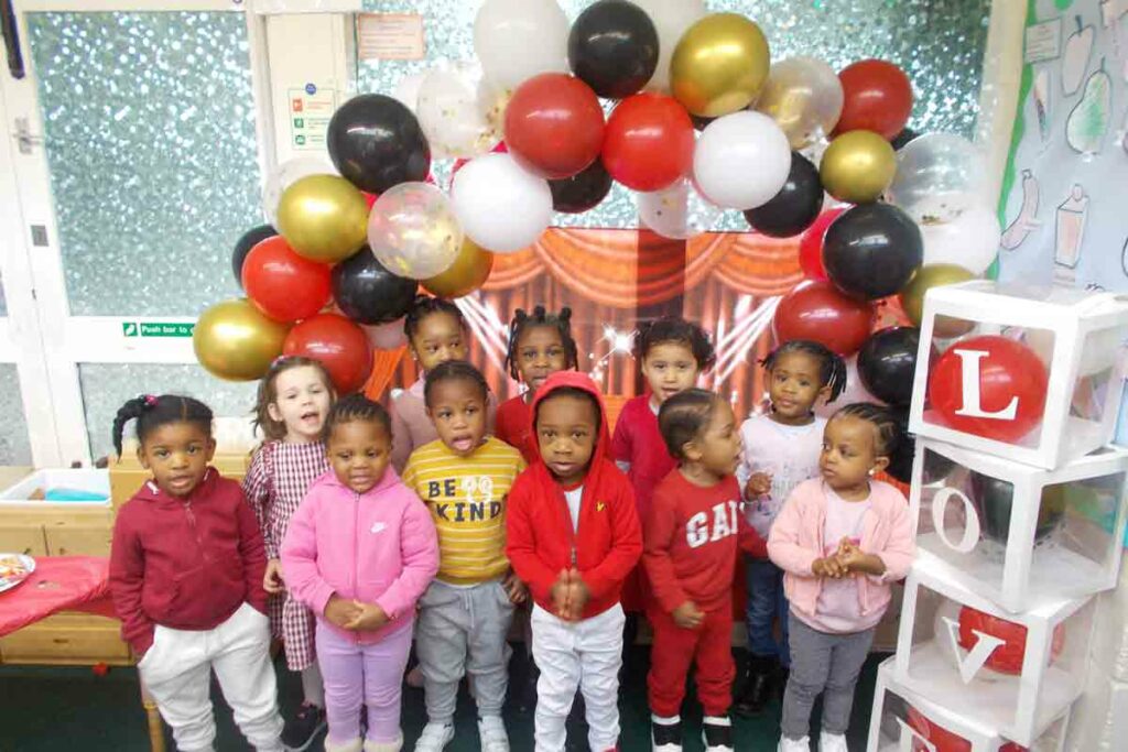 children in nursery with balloons