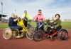 four people with disability cycles