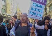 woman at protest with placard