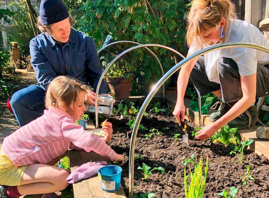 children and adults gardening