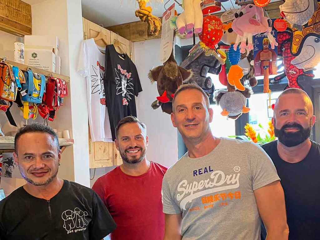 four men in shop