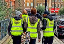 school patrol volunteers in branded tabards