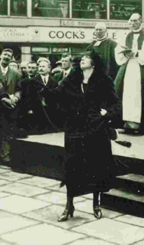 old photo of woman at public ceremony