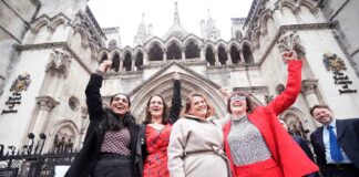 women celebrate outside court
