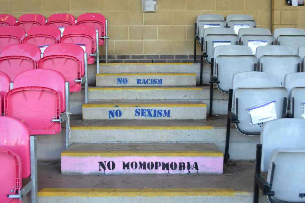 slogans painted on steps at sports stadium