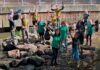 people display litter cleared from an urban river