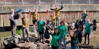 people display litter cleared from an urban river