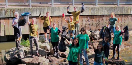 people display litter cleared from an urban river