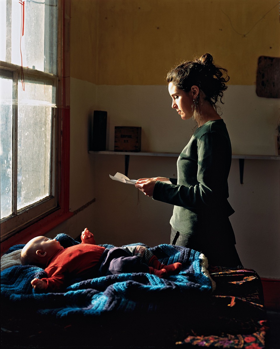 photo of woman at window