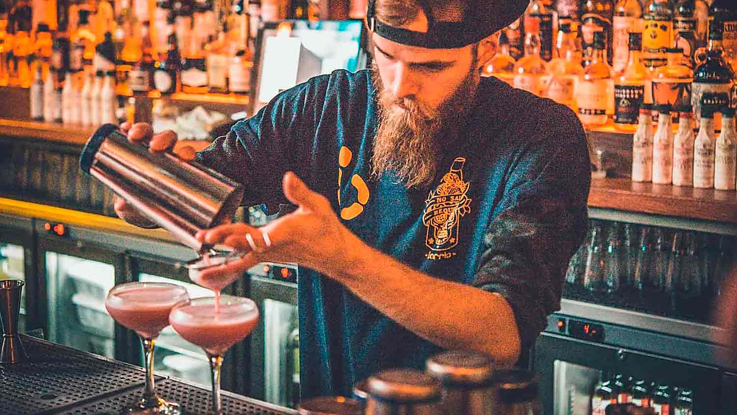 man mixing cocktail
