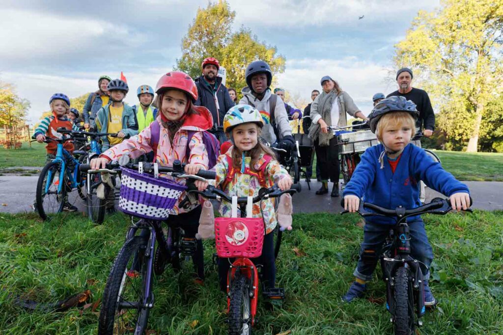 children and parents with bicycles