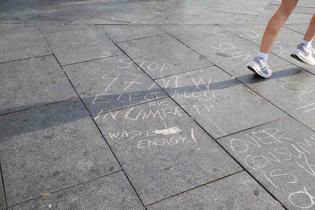 slogans chalked on pavement