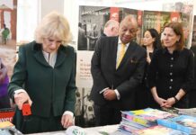 woman stamps a book