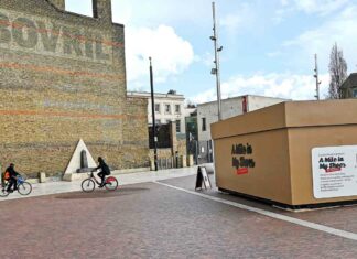 urban street scene with giant shoebox installation
