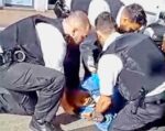 police pin woman to the ground