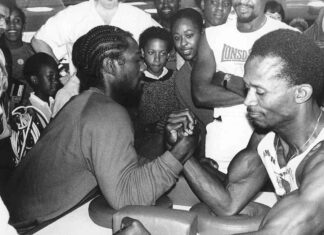 mono image of men arm-wrestling