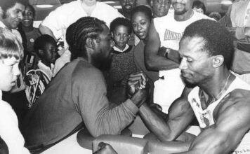 mono image of men arm-wrestling