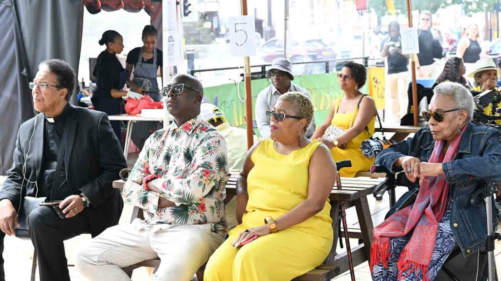 people sitting at open air event