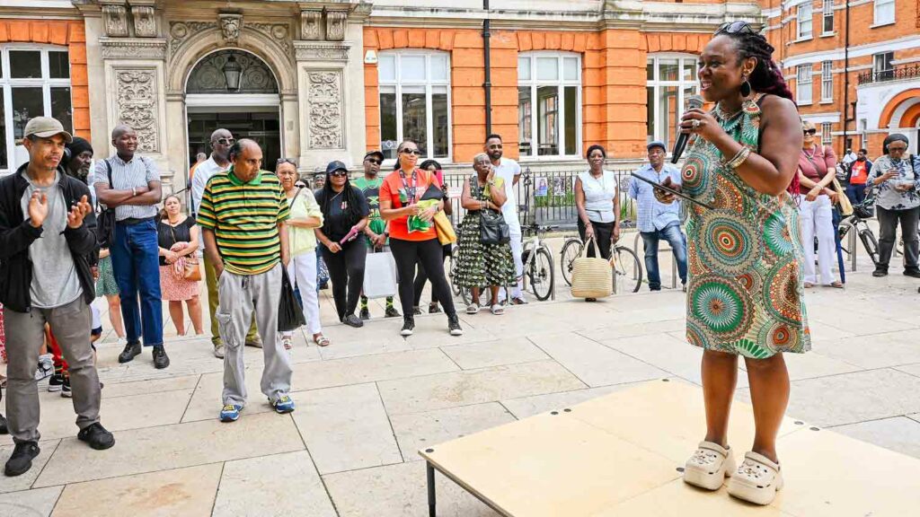 woman reading poetry at open air event 