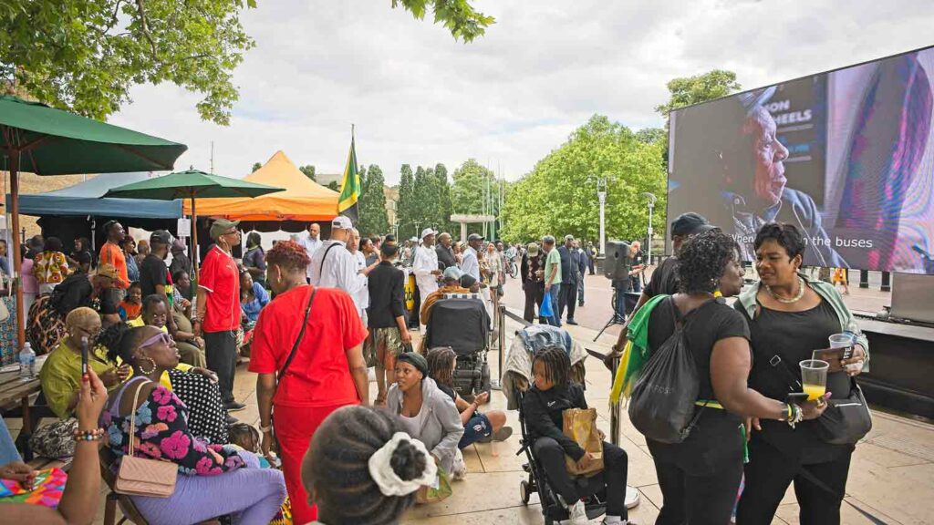 people watch open air film screening