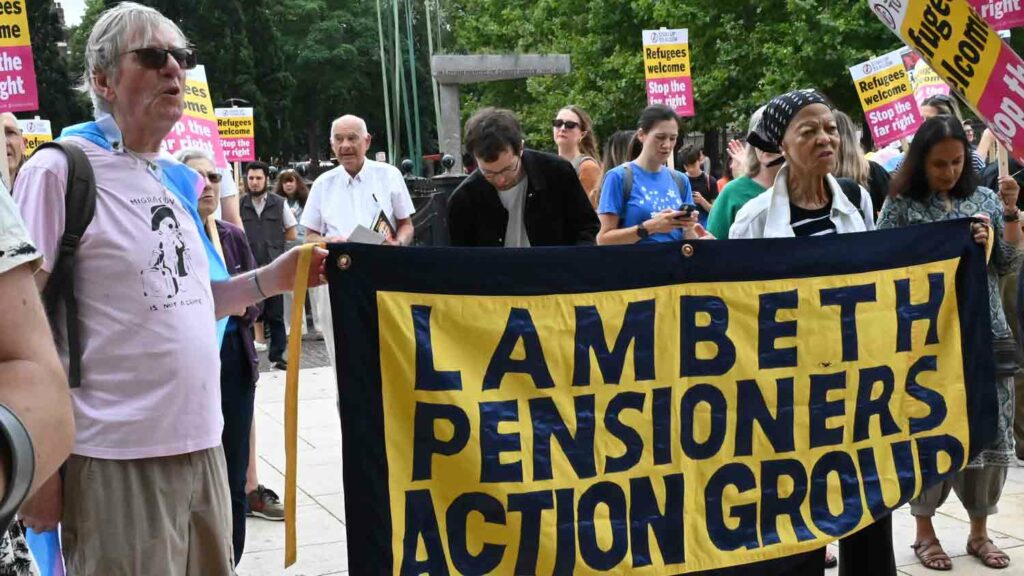 people with banner at a rally