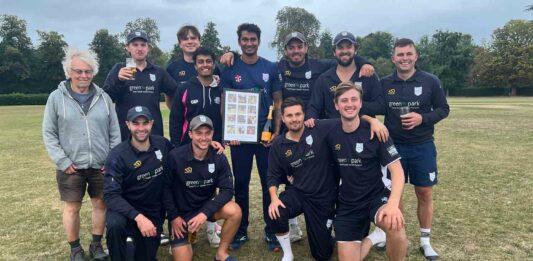 cricket team poses for photo