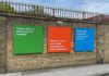 school exterior wall with signs