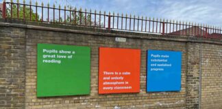 school exterior wall with signs