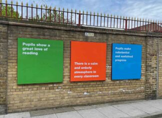 school exterior wall with signs