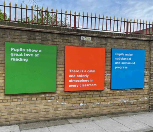 school exterior wall with signs