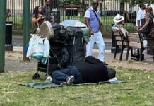 homeless person sleeping in public space