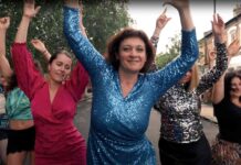 women dancing in street