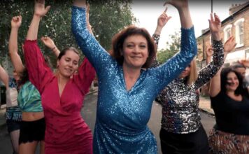 women dancing in street