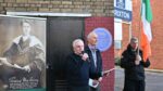 man speaking at public meeting