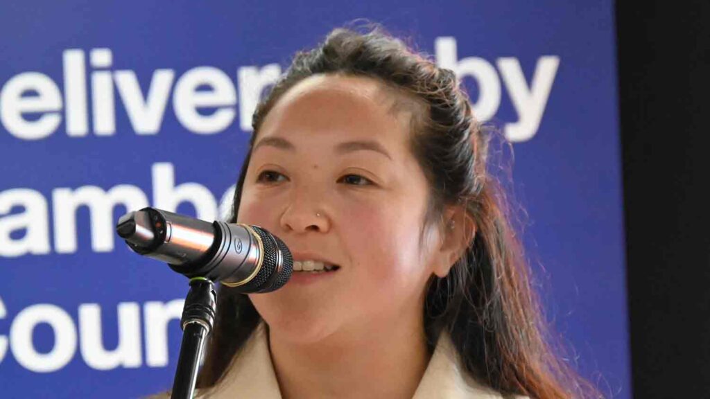 woman speaking into mic