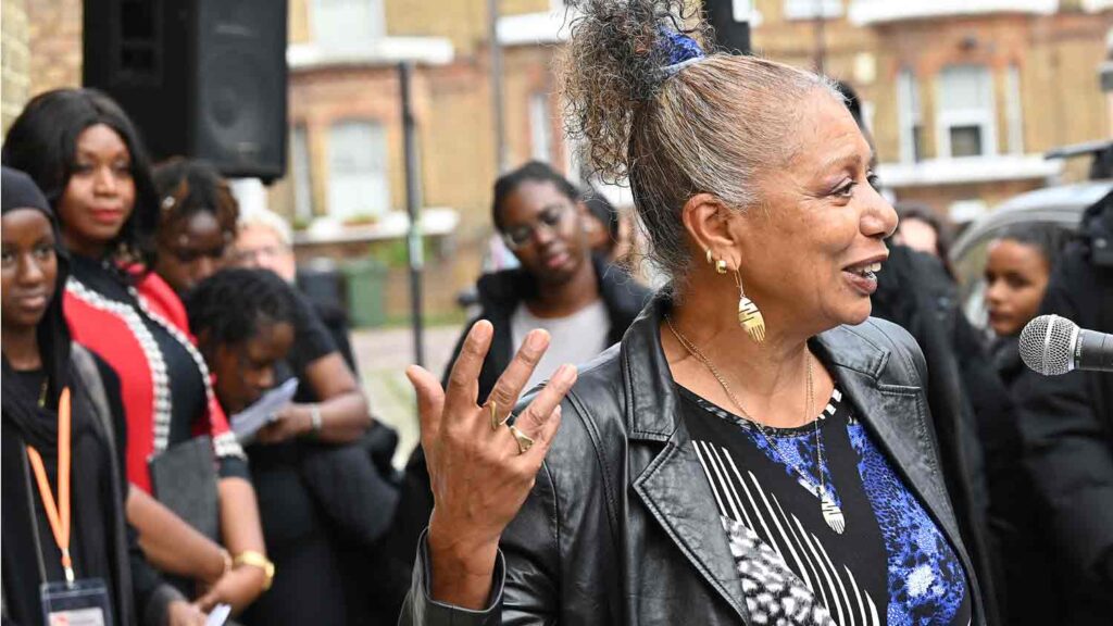 woman speaking at public ceremony