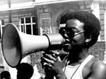 woman speaks into megaphone