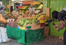 filming a market stall