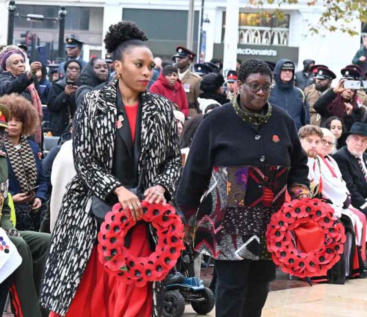 women with wreaths at public ceremony