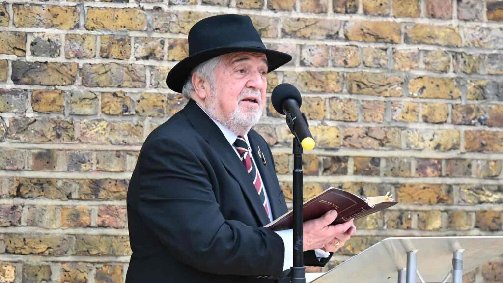 man reads at public ceremony