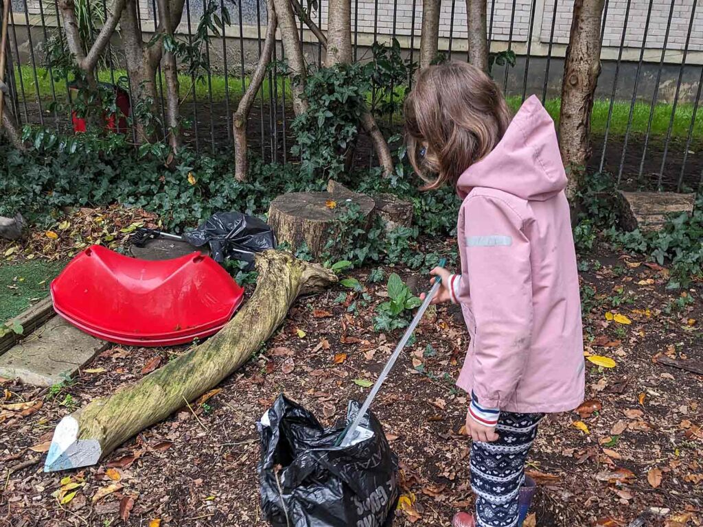 child picking litter