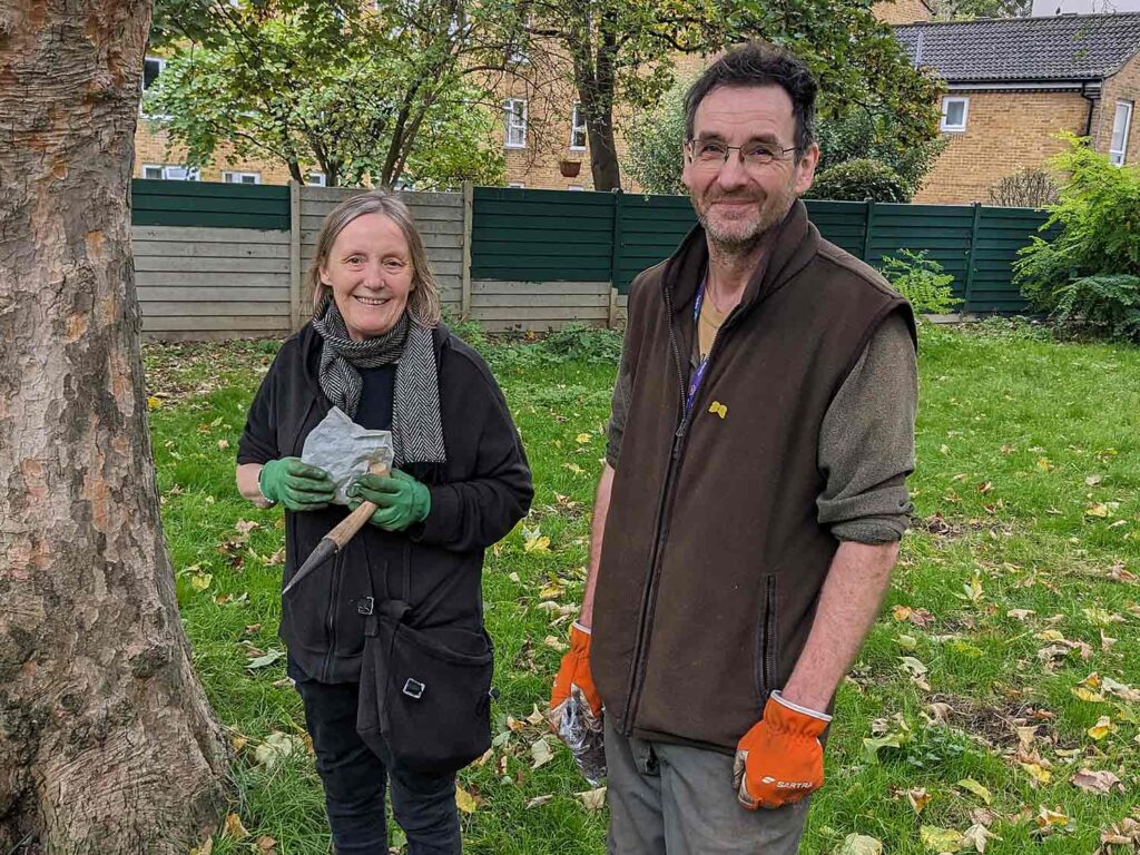 couple with gardening tools