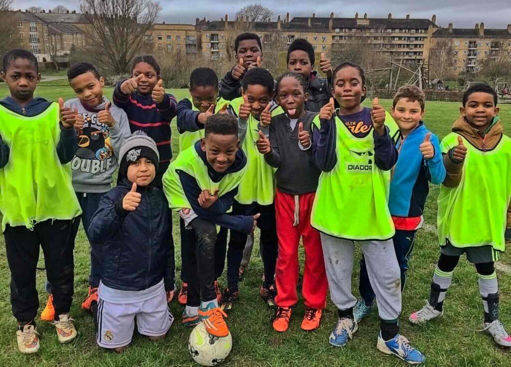 young footballers pose for photo