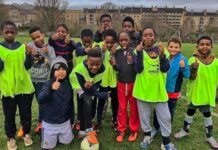 young footballers pose for photo