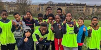 young footballers pose for photo