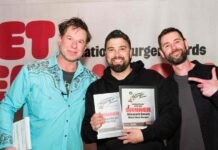 three men at awards ceremony