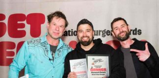 three men at awards ceremony